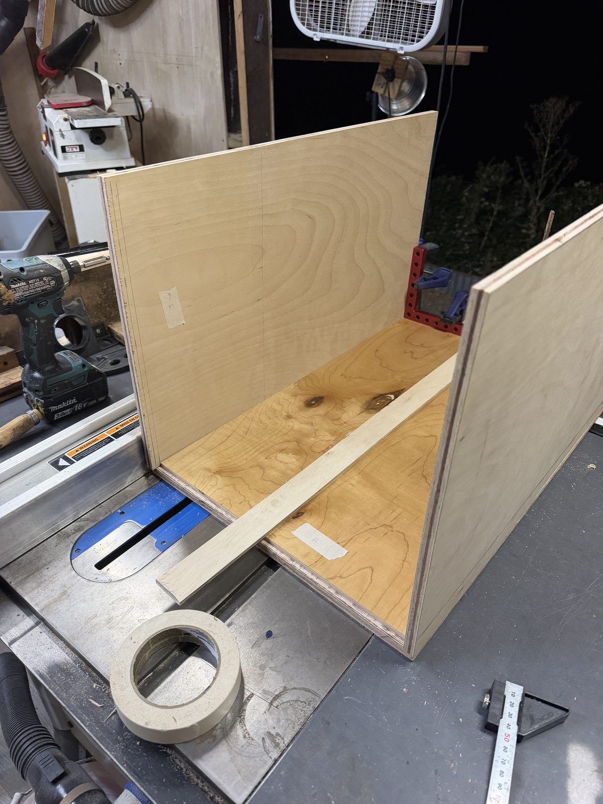 Birch walls taped and clamped as the carcass goes together