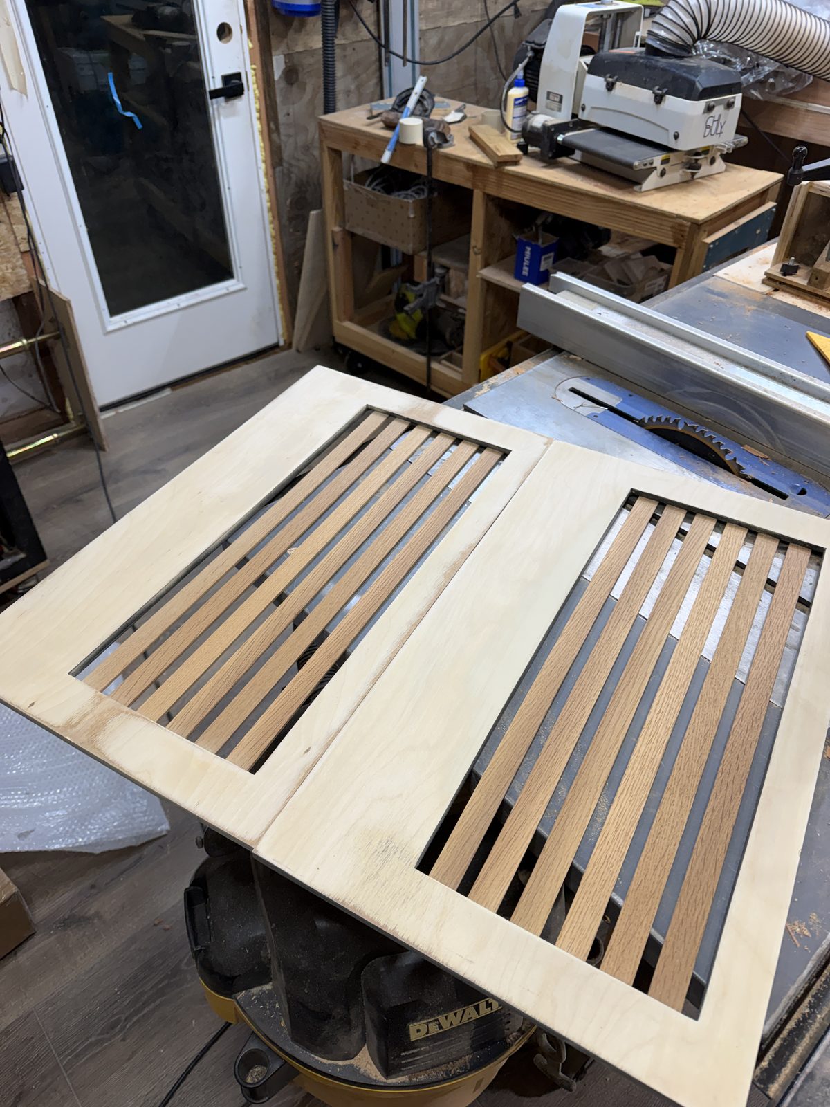 Two slatted side panels on the table saw