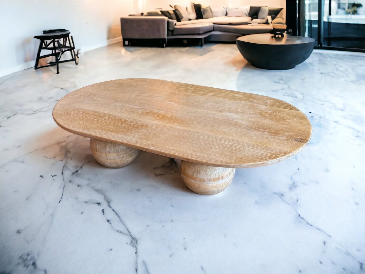 Oval coffee table on turned sphere legs